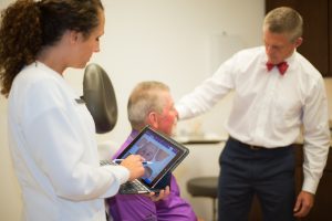 Dr. Rogers giving an examination