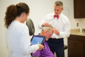 Dr. Rogers treating patient for seborrheic dermatitis